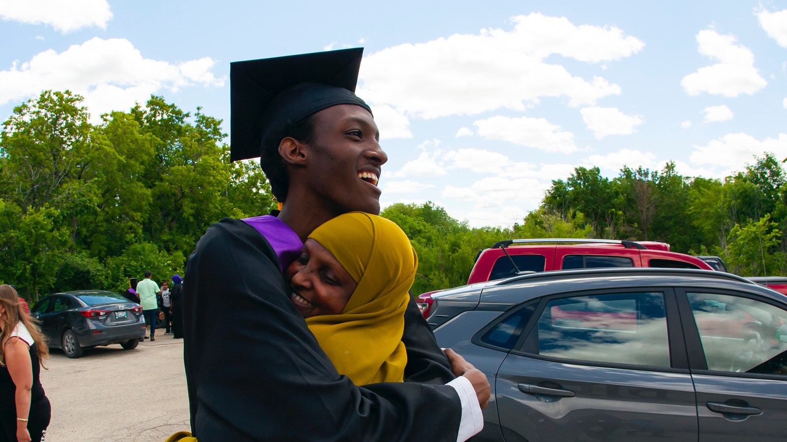 Student and his mother celebrate at Gordon Bell's graduation.